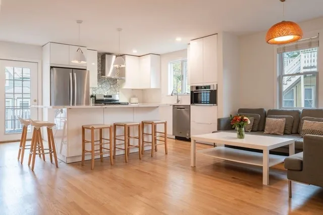 a view of a living room and dining room