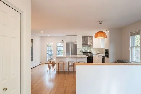 a house that has a tree in front of it