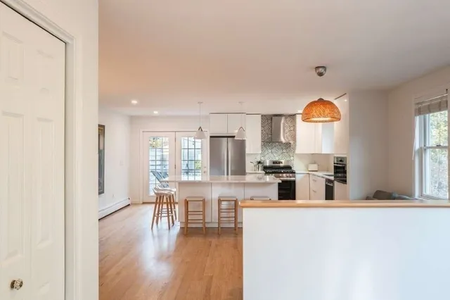 a house that has a tree in front of it