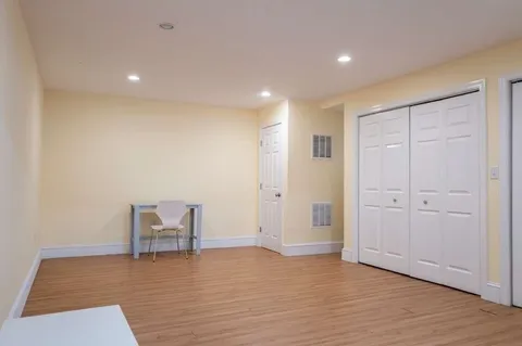 a view of a house with wooden fence