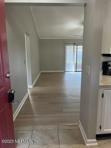 a view of an empty room with a window