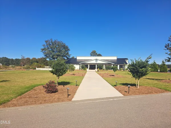a front view of a house with a ocean view
