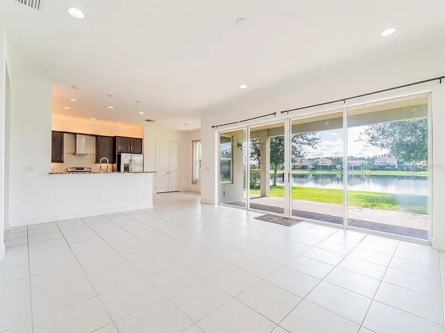 a view of a kitchen with a sink and an open kitchen view