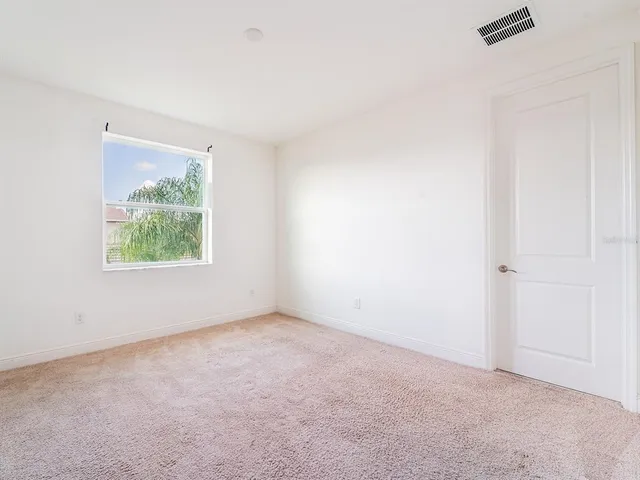 a bathroom with a granite countertop sink a toilet and bathtub