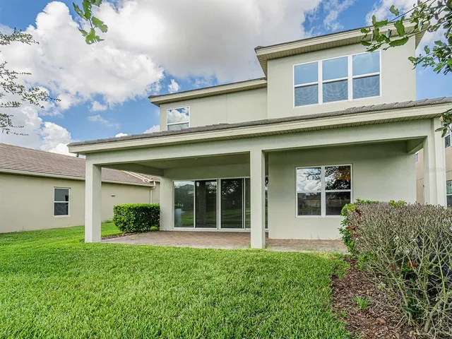 an aerial view of a houses with outdoor space and street view