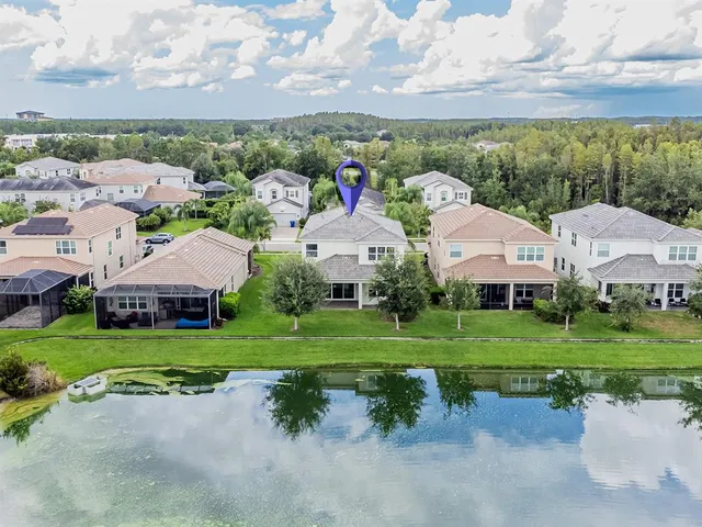 an aerial view of residential houses with outdoor space