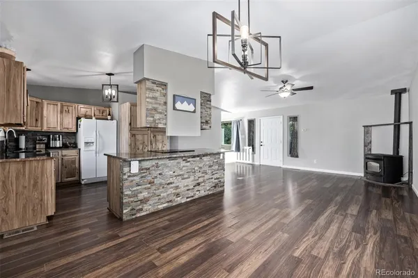 a kitchen with stainless steel appliances a refrigerator sink and cabinets