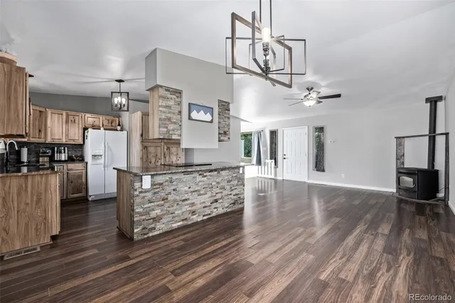a kitchen with stainless steel appliances a stove sink and microwave