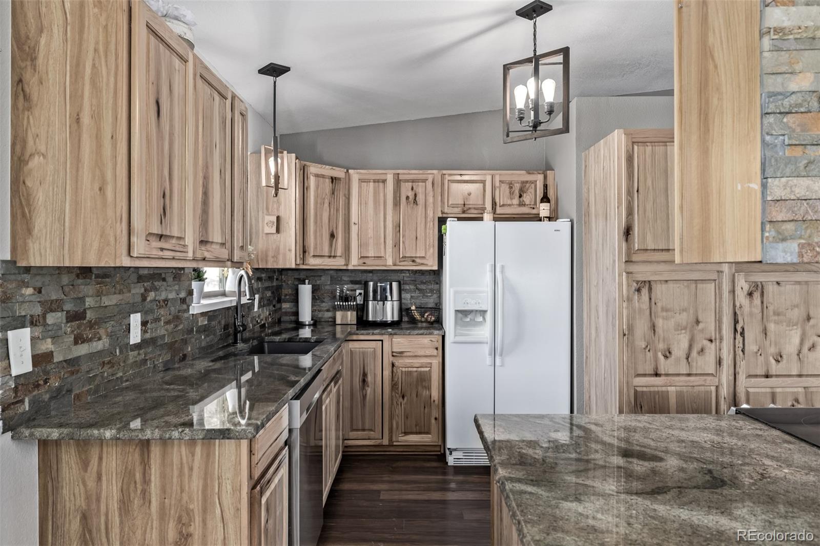20 Parkview Bailey, CO 80421 - Photo 19 of 50 a kitchen with stainless steel appliances a refrigerator sink and cabinets