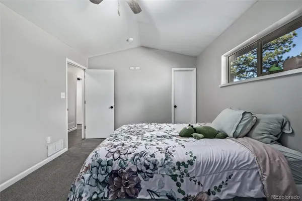 a bathroom with a double vanity sink a mirror a bathtub and shower