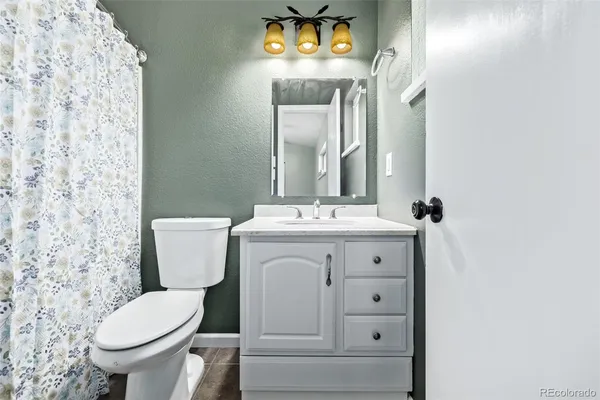 a bathroom with double sink and a mirror