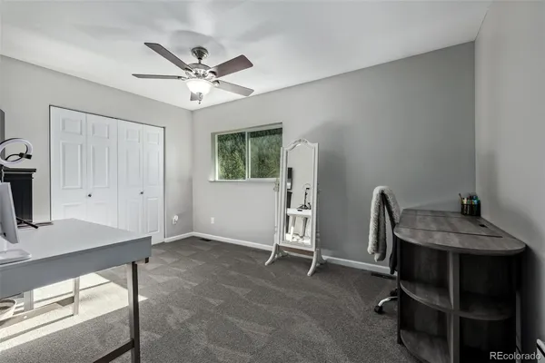 a view of an empty room with a window