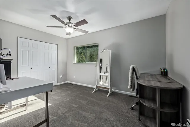 a bedroom with a bed and a tv