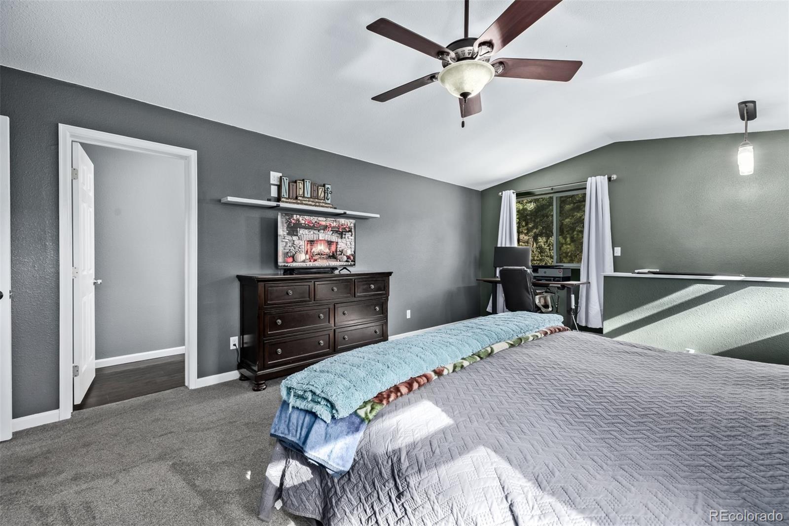 20 Parkview Bailey, CO 80421 - Photo 28 of 50 a bedroom with a bed and a dresser