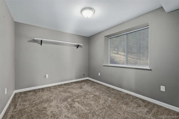 a view of a town with mountains in the background