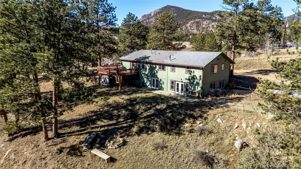 a view of kitchen with sink microwave and refrigerator