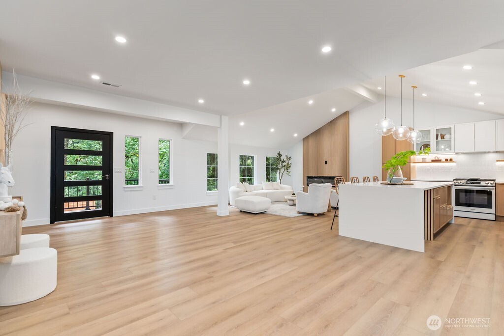 19433 Southeast 128th Street Renton, WA 98059 - Photo 11 of 40 a view of a living room kitchen and a wooden floor
