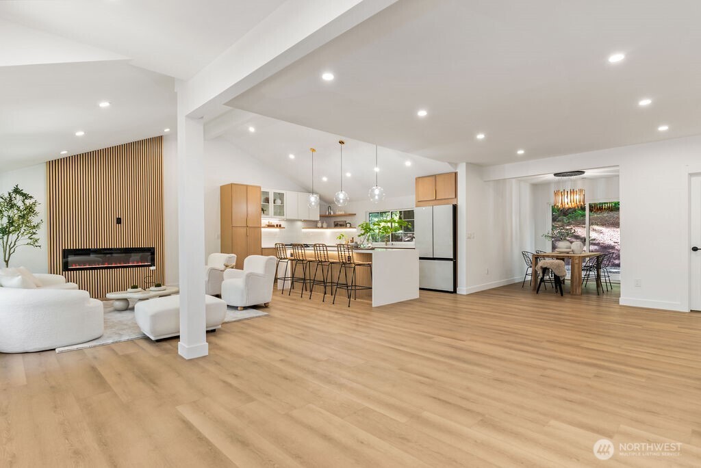 19433 Southeast 128th Street Renton, WA 98059 - Photo 15 of 40 a view of a kitchen with kitchen island and stainless steel appliances