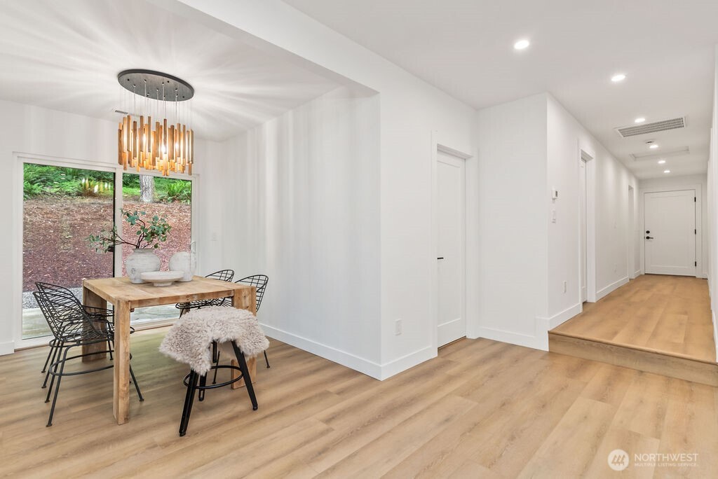 19433 Southeast 128th Street Renton, WA 98059 - Photo 24 of 40 a workspace with wooden floor and a large window