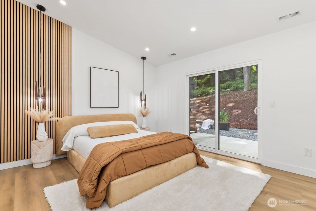 19433 Southeast 128th Street Renton, WA 98059 - Photo 30 of 40 a bedroom with a large bed and a large window