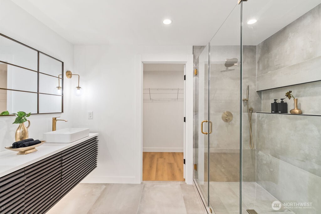 19433 Southeast 128th Street Renton, WA 98059 - Photo 32 of 40 a bathroom with a double vanity sink and shower