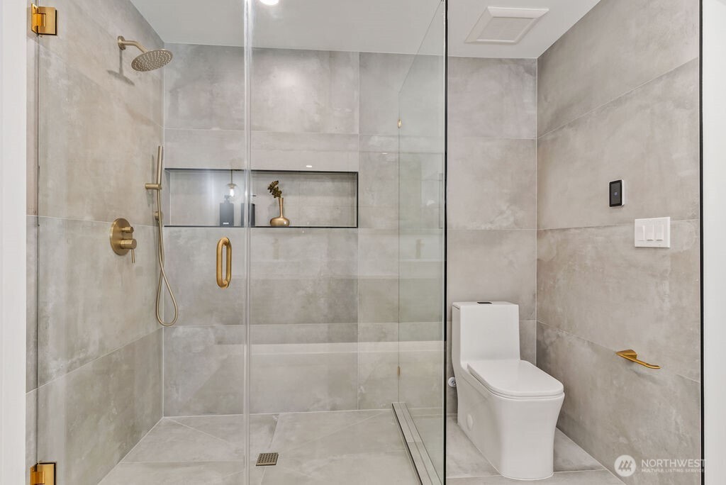 19433 Southeast 128th Street Renton, WA 98059 - Photo 34 of 40 a bathroom with a shower and toilet