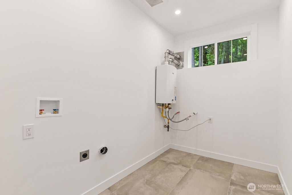 19433 Southeast 128th Street Renton, WA 98059 - Photo 35 of 40 a view of a room with rack on the wall