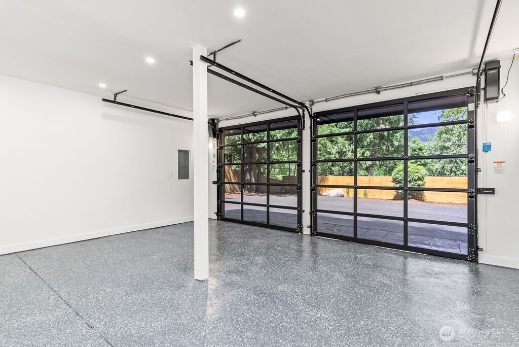 19433 Southeast 128th Street Renton, WA 98059 - Photo 36 of 40 an empty room with sliding door and mountain view
