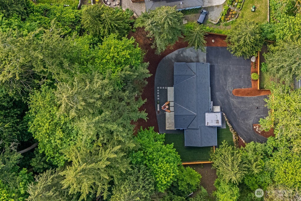 19433 Southeast 128th Street Renton, WA 98059 - Photo 6 of 40 an aerial view of a house with outdoor space and trees all around