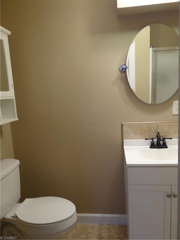 524 High Point Street Randleman, NC 27317 - Photo 14 of 30 Master bathroom with tile floor and shower