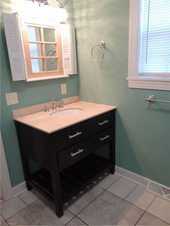 524 High Point Street Randleman, NC 27317 - Photo 22 of 30 2nd full bathroom on main level