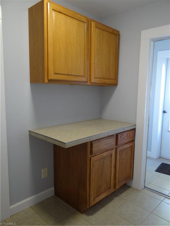 524 High Point Street Randleman, NC 27317 - Photo 23 of 30 Mud Room with built in cabinets and tile flooring