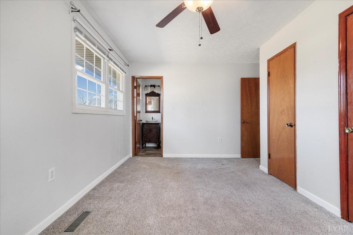 813 Doss Road Concord, VA 24538 - Photo 13 of 31 an empty room with windows and closet