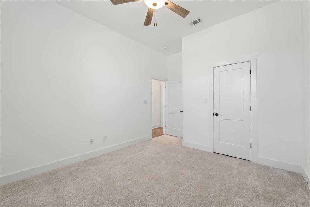 10708 Maximus Street Waco, TX 76712 - Photo 24 of 40 an empty room with a ceiling fan and a window