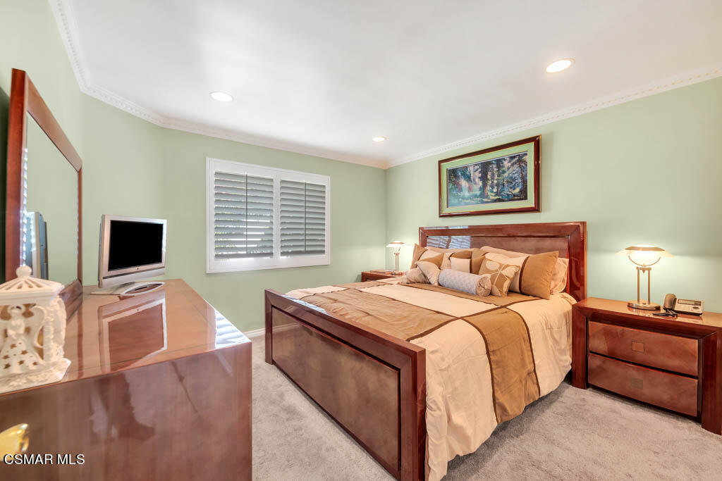 1736 Sinaloa Road, Unit 324 Simi Valley, CA 93065 - Photo 13 of 37 a bedroom with a bed and a flat screen tv