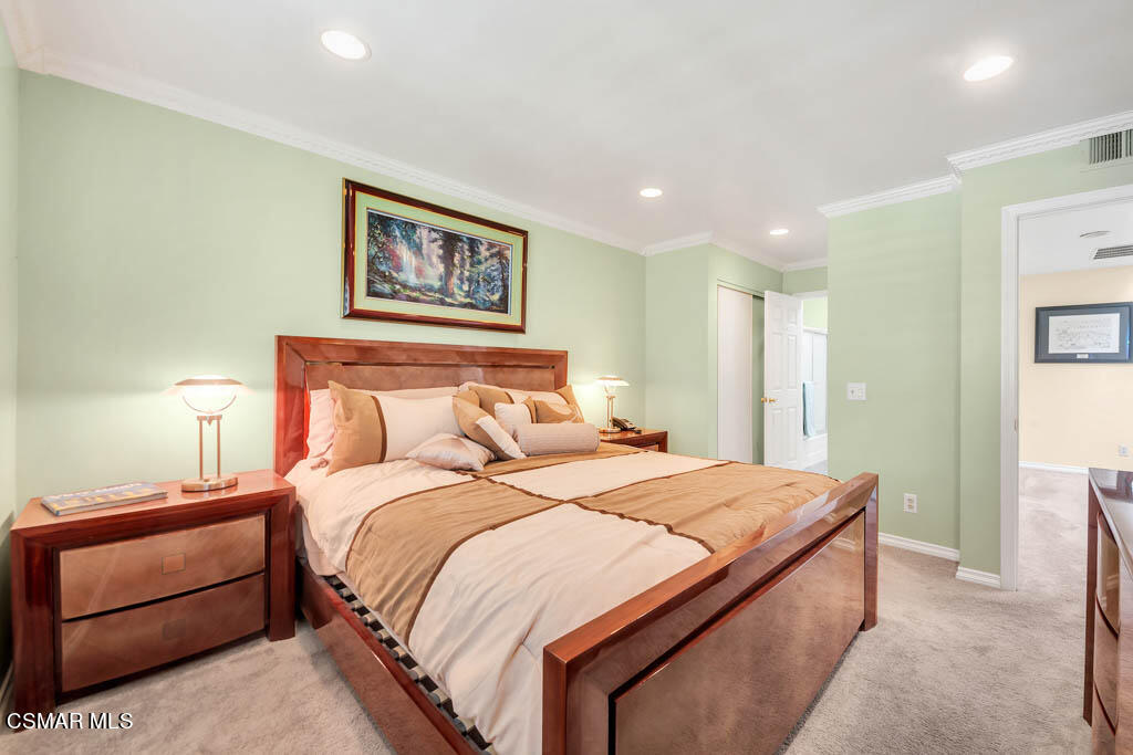 1736 Sinaloa Road, Unit 324 Simi Valley, CA 93065 - Photo 14 of 37 a bedroom with a bed and a painting