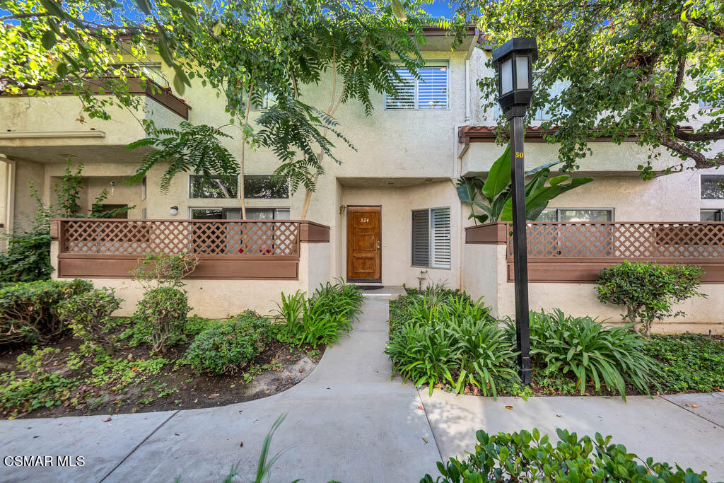 1736 Sinaloa Road, Unit 324 Simi Valley, CA 93065 - Photo 23 of 37 a front view of a house with garden