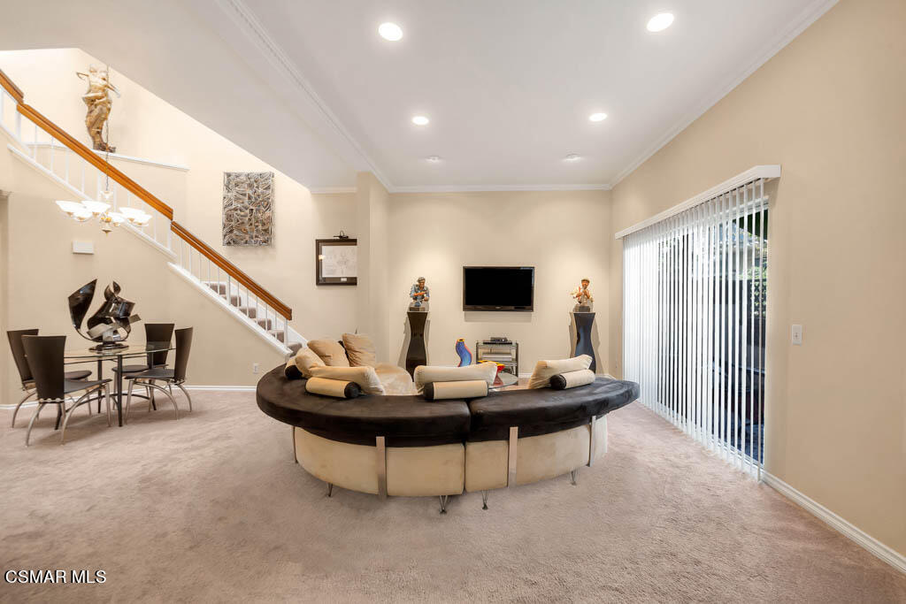 1736 Sinaloa Road, Unit 324 Simi Valley, CA 93065 - Photo 3 of 37 a living room with furniture and flat screen tv