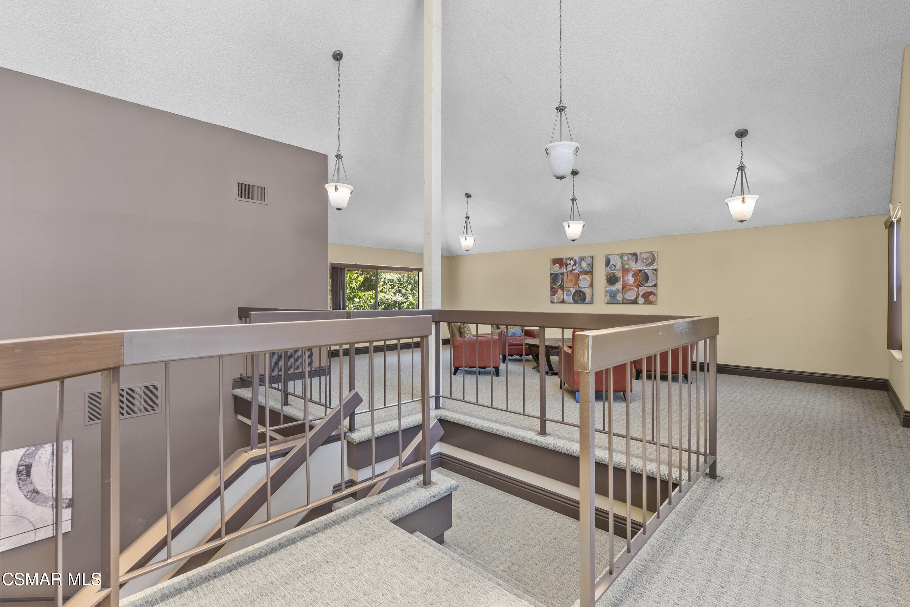 1736 Sinaloa Road, Unit 324 Simi Valley, CA 93065 - Photo 33 of 37 a view of a hallway with stairs