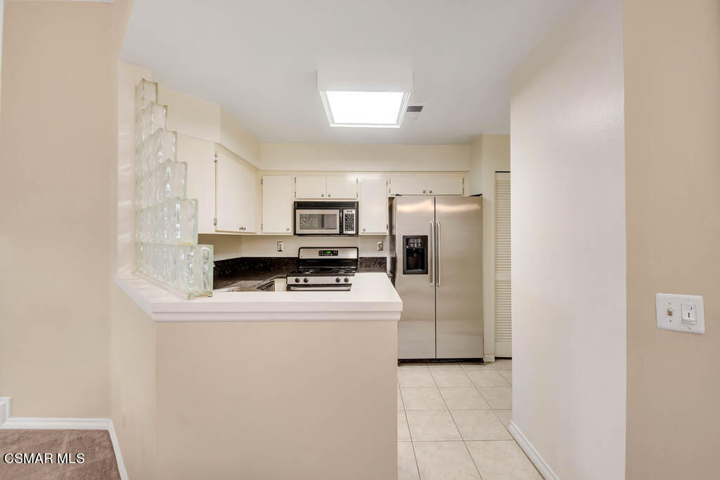 1736 Sinaloa Road, Unit 324 Simi Valley, CA 93065 - Photo 7 of 37 a utility room with washer and dryer