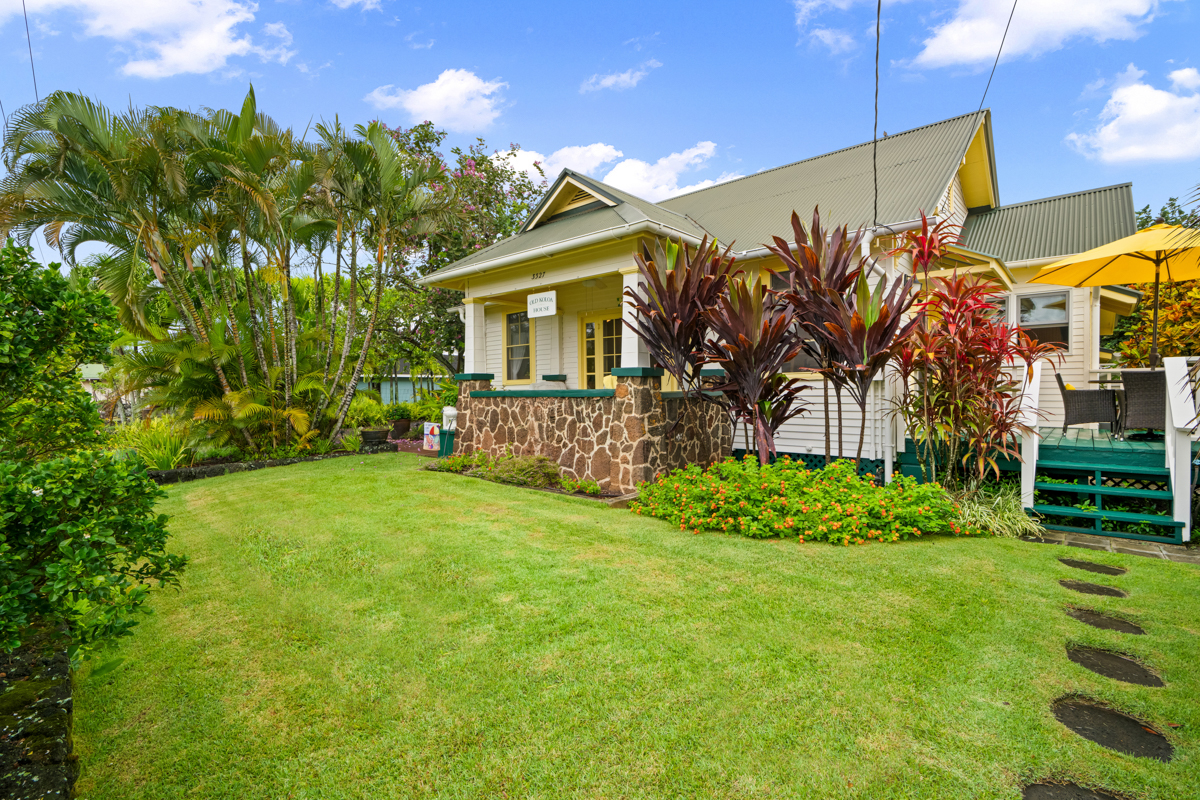 3327 Waikomo Road Koloa, HI 96756 - Photo 2 of 2 a front view of a house with garden