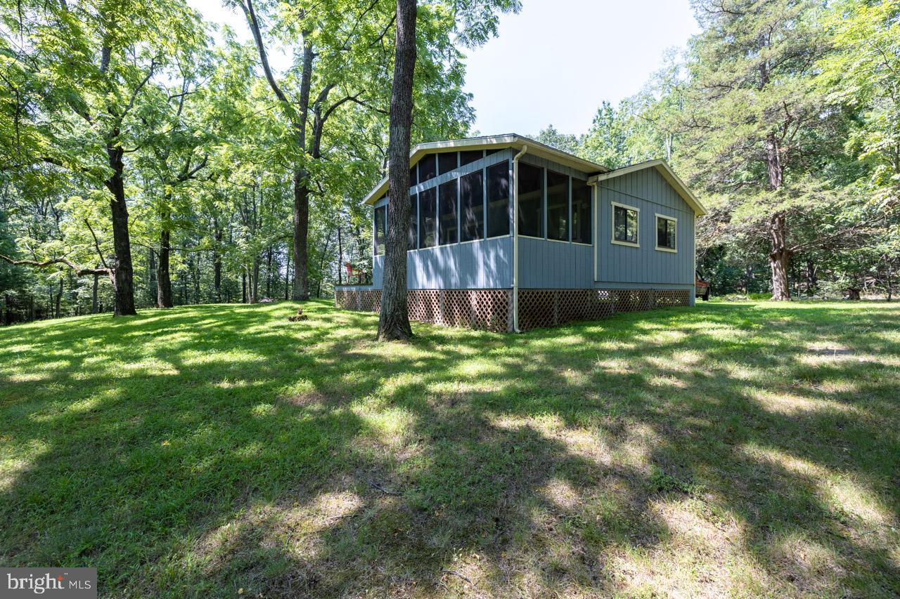 1017 North Maple Road Mount Jackson, VA 22842 - Photo 18 of 37 a backyard of a house with table and chairs