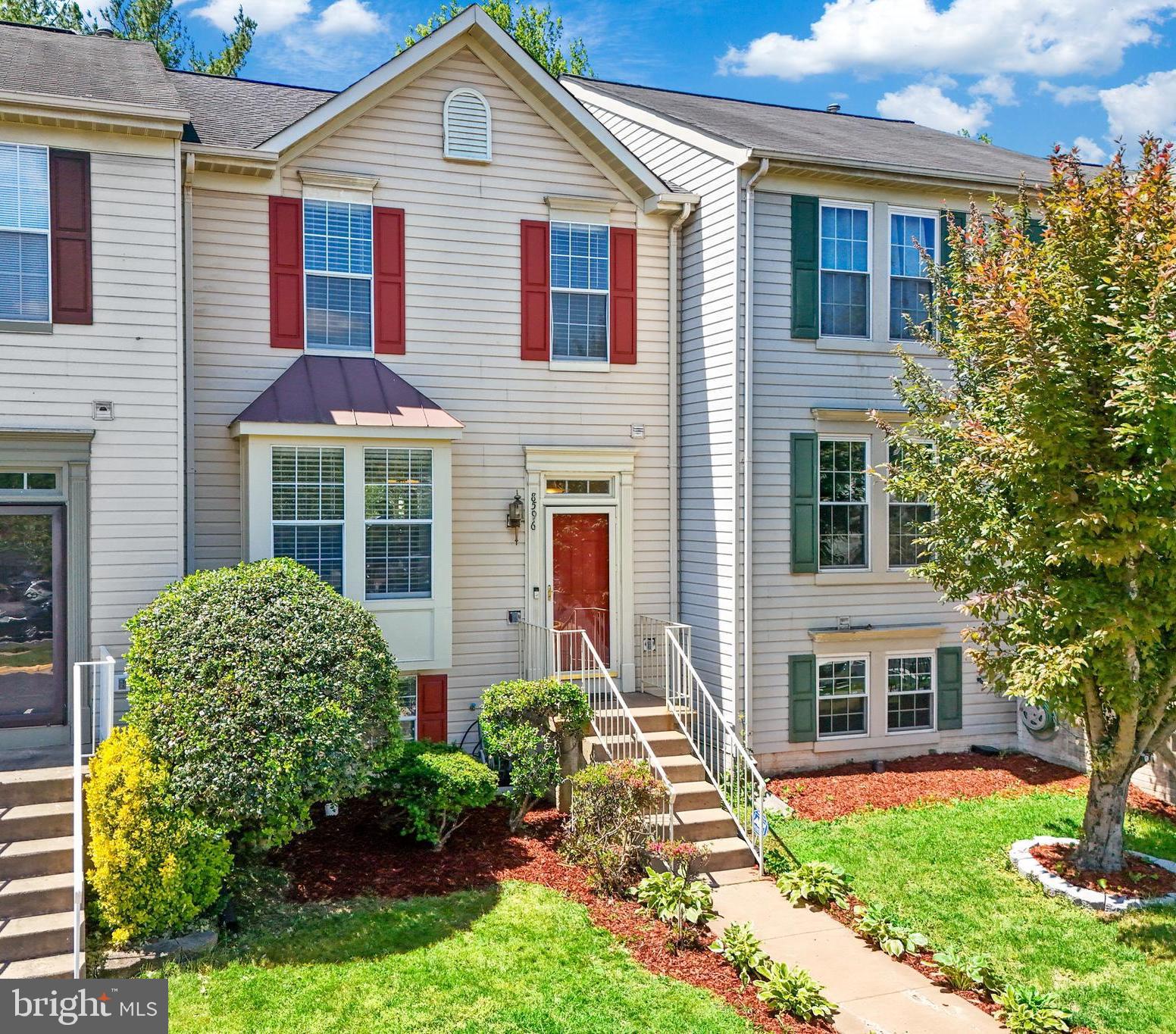 8596 Cold Harbor Loop Manassas, VA 20111 - Photo 1 of 52 front view of a house with a yard