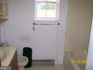 6331 Basket Switch Road Newark, MD 21841 - Photo 6 of 9 a bathroom with a toilet and a bathtub