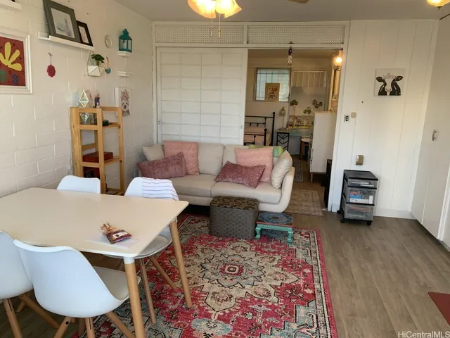a living room with furniture and a table