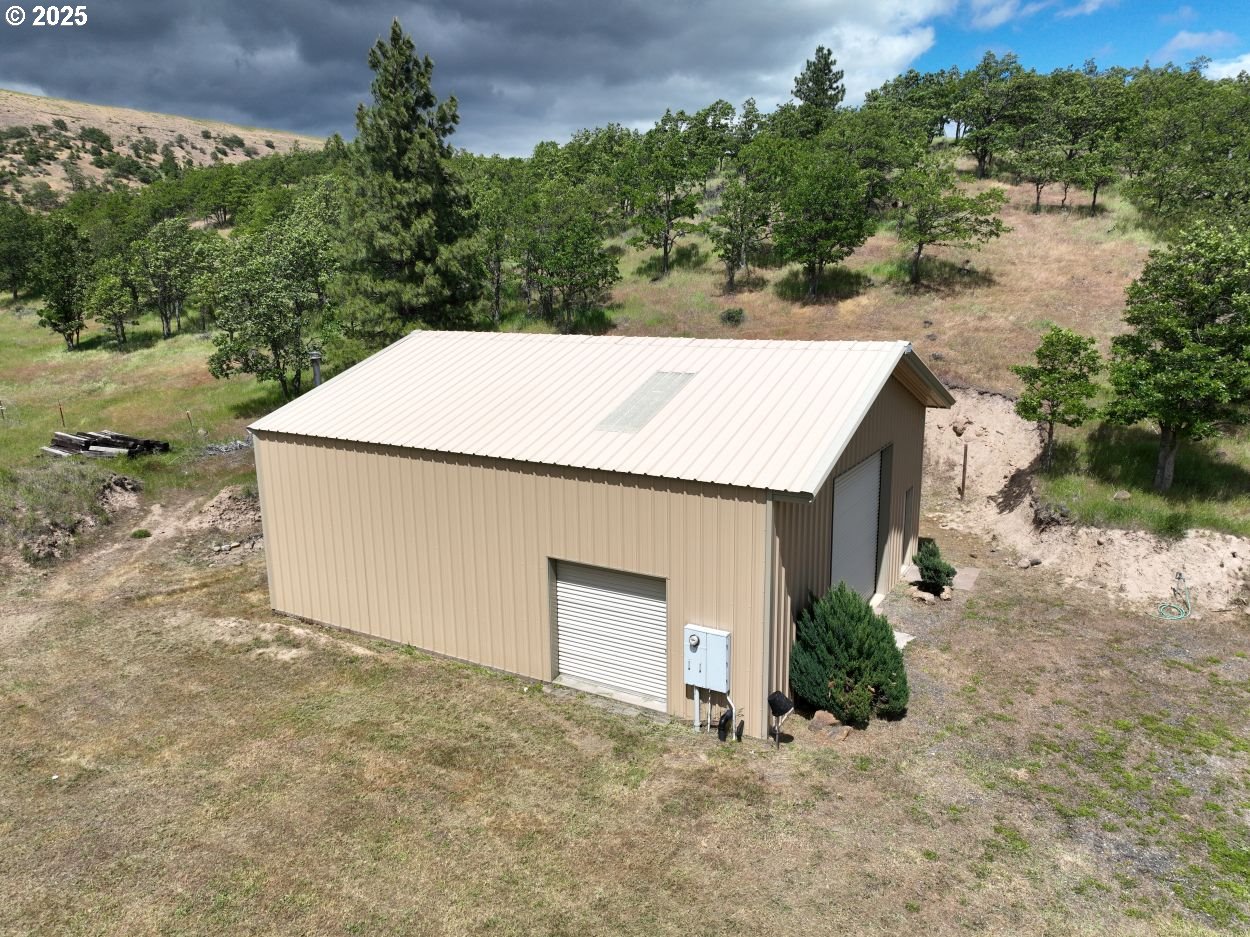 4397 Browns Creek Road The Dalles, OR 97058 - Photo 12 of 37 a view of a house with a yard and garage