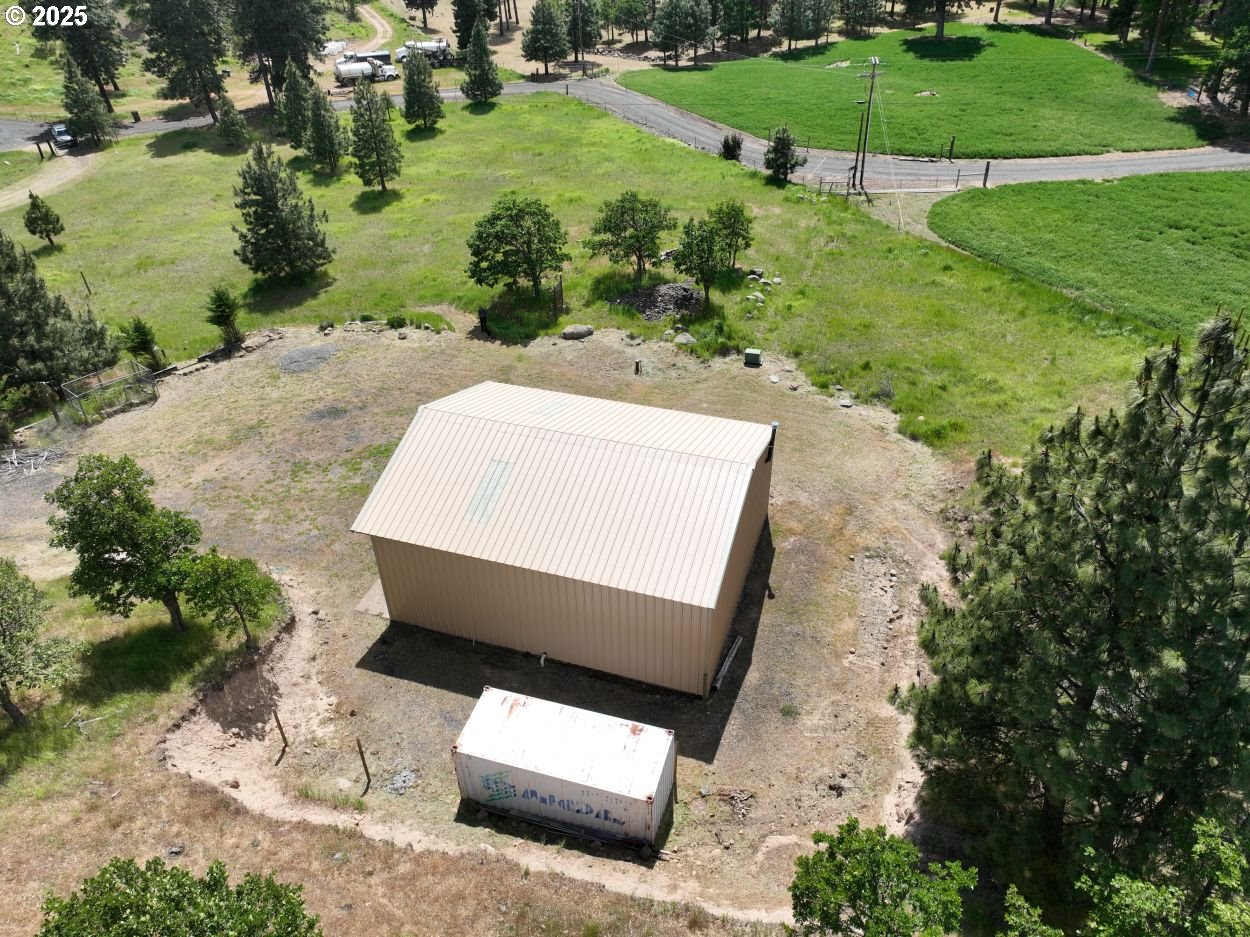 4397 Browns Creek Road The Dalles, OR 97058 - Photo 5 of 37 an aerial view of a yard with a swimming pool and green space