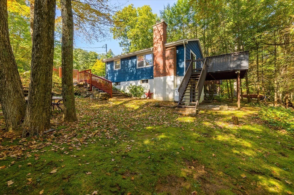 117 May Brook Road Holland, MA 01521 - Photo 18 of 30 a backyard of a house with lots of green space