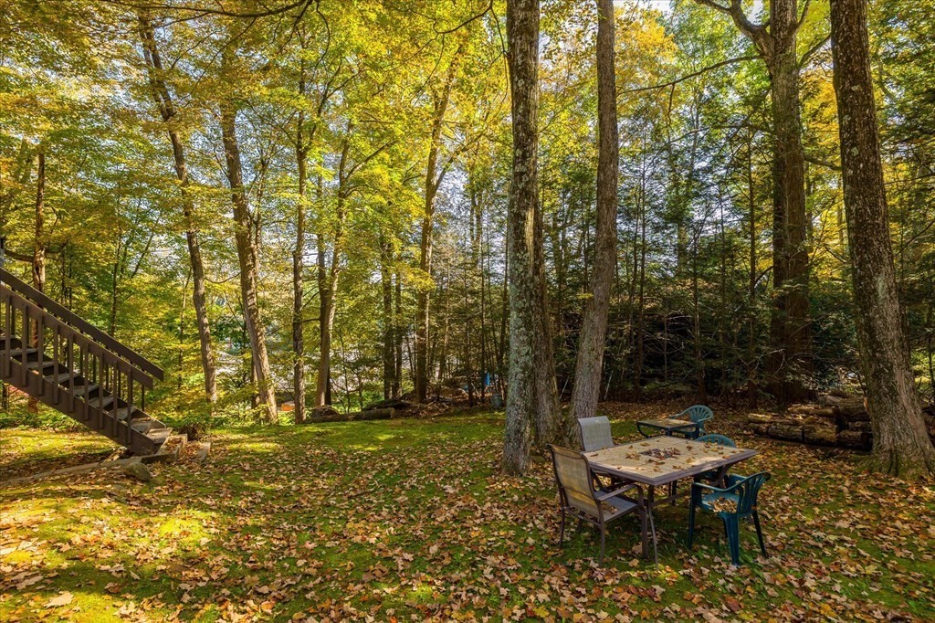 117 May Brook Road Holland, MA 01521 - Photo 19 of 30 a backyard of a house with table and chairs