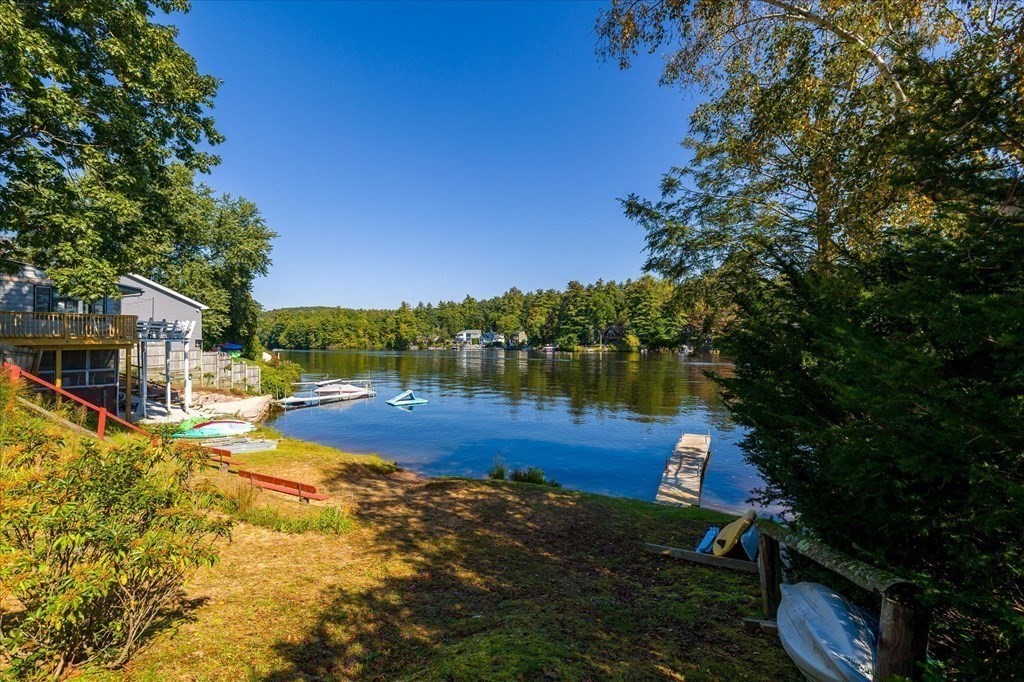 117 May Brook Road Holland, MA 01521 - Photo 22 of 30 a view of a yard with plants and large trees
